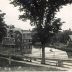 A view of the Vernon mills and mill pond from the road